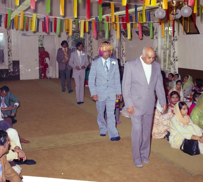 [Photo of Baldave Sidhu and wedding guests]