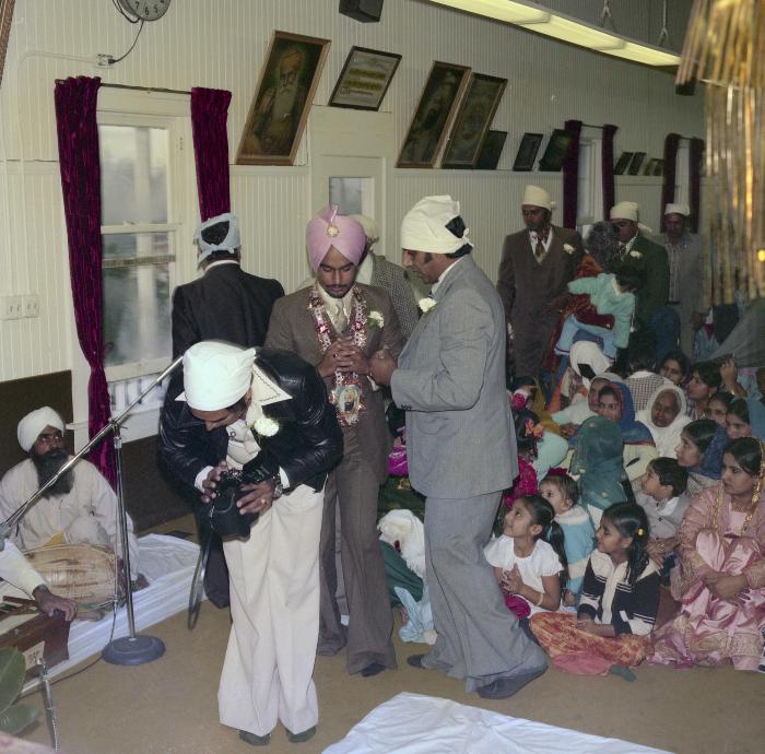 [Photo of Iqbal Sandhu and his wedding guests]