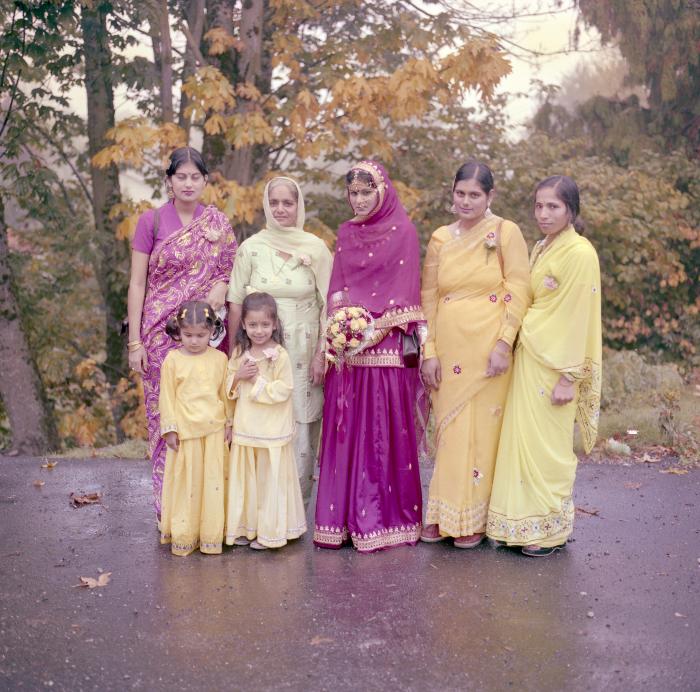 [Photo of Chindo Sidhu and a group of unidentified women]