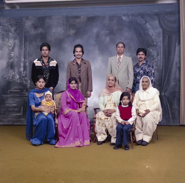 [Portrait of Chindo Sidhu, Iqbal Sandhu and family members at their wedding]