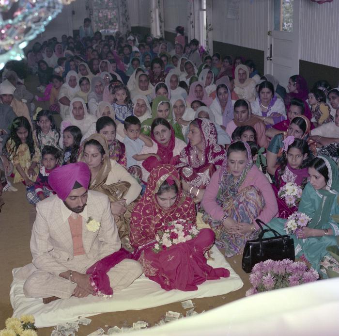 [Photo of Sinder Sandhu, Jaswant Gill and their wedding guests]