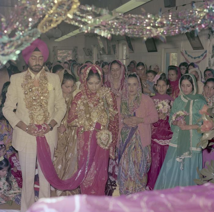 [Photo of Sinder Sandhu, Jaswant Gill and their wedding guests]