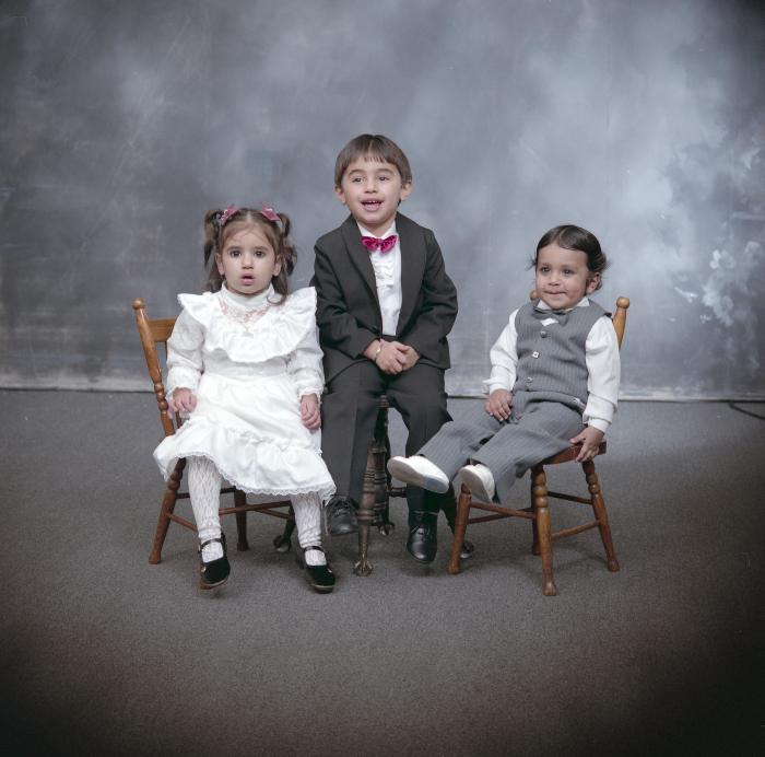 [Group portrait of three unidentified children]