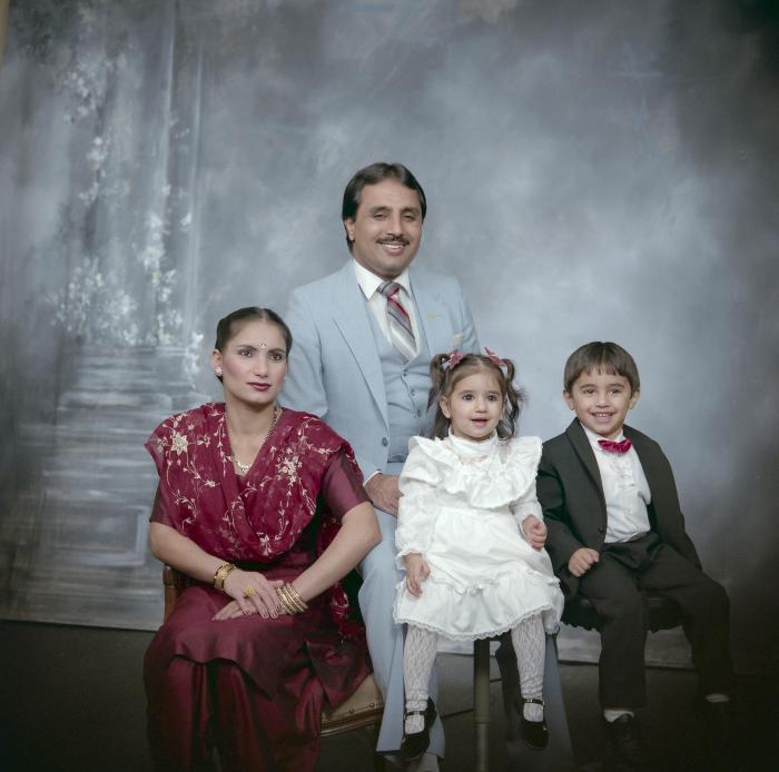 [Group portrait of an unidentified man, an unidentified woman and two unidentified children]