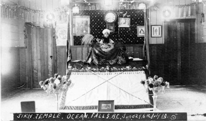 [Photo of Granthi at Ocean Falls Sikh Temple]