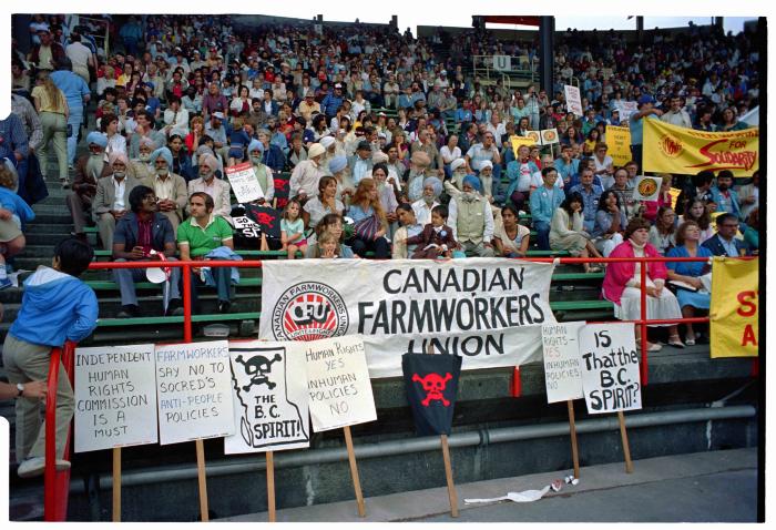 [Photo of Canadian Farmworkers Union representatives at the 1983 Solidarity Rally at Empire Stadium]