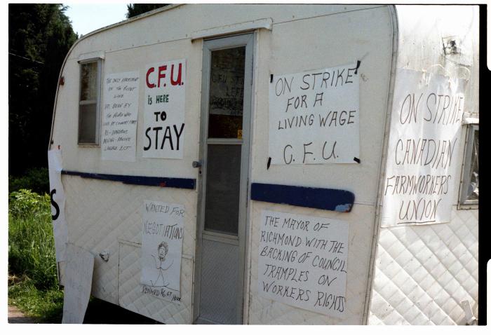 [Photo of a trailer with posters of Canadian Farmworkers Union, Fraser Valley, BC]