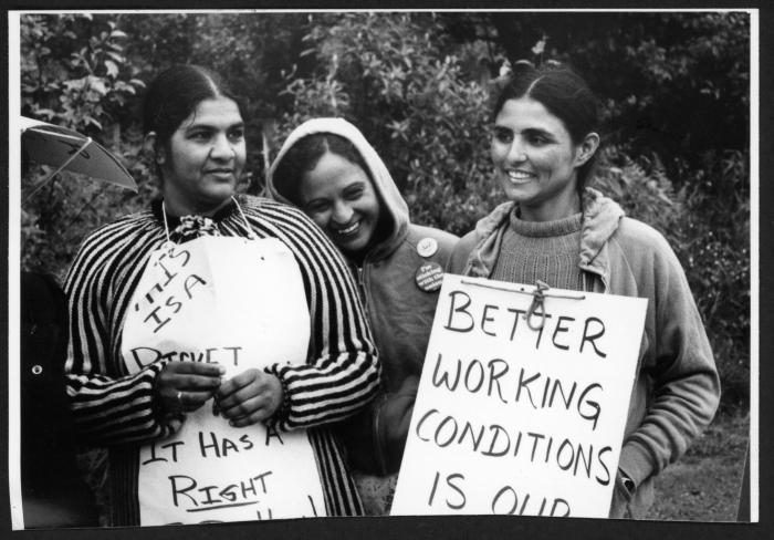 [Photo of women farmworkers protesting for better working conditions]