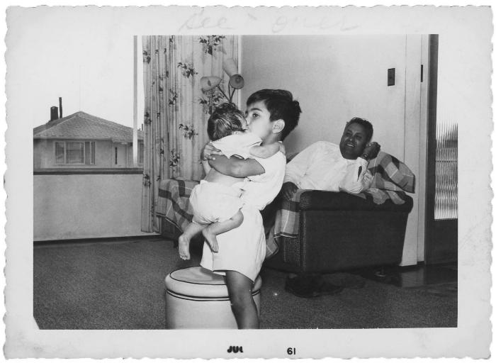 [Photo of Gurmail Singh Gill's little brother with an unidentified baby and an unidentified man]
