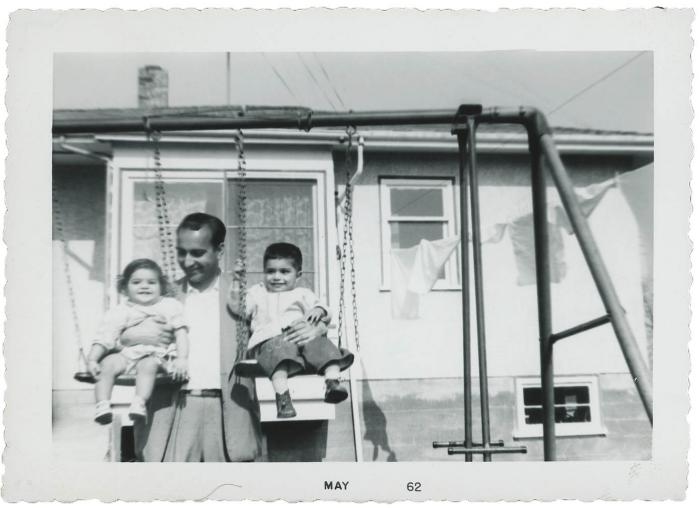 [Photo of Gurmail Singh Gill's father[?] and his siblings on a swing]
