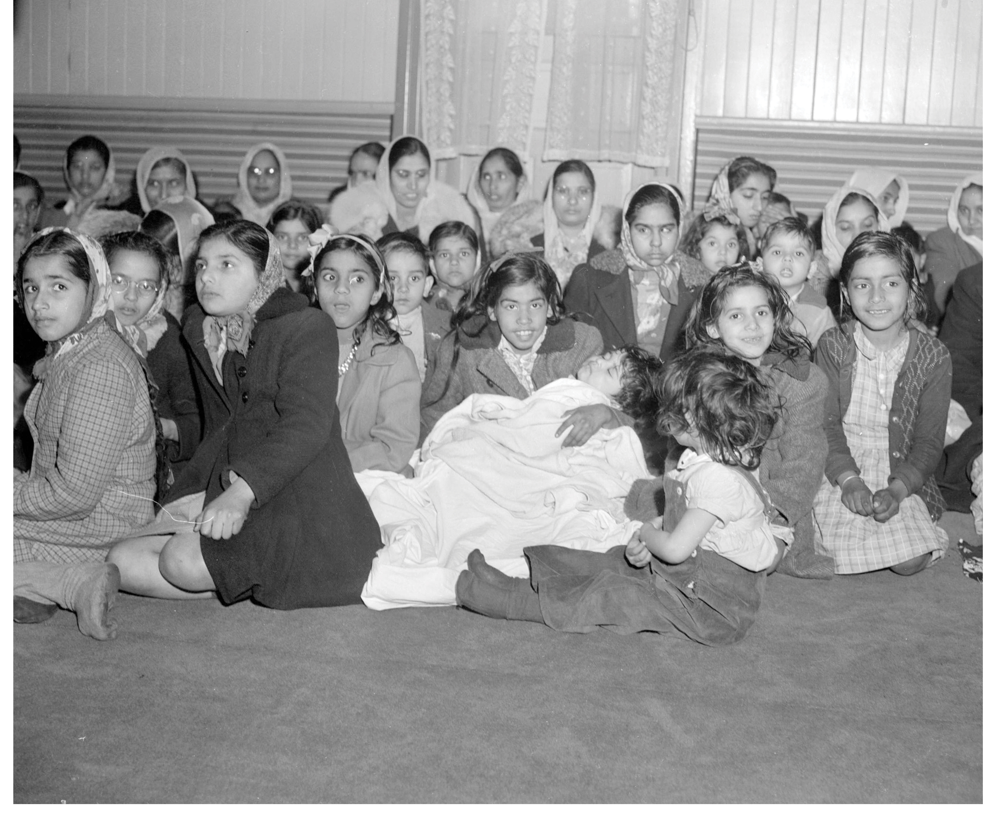 Women and children inside the Khalsa Diwan Society Sikh Temple