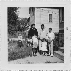[Bonto Singh and family in front yard]