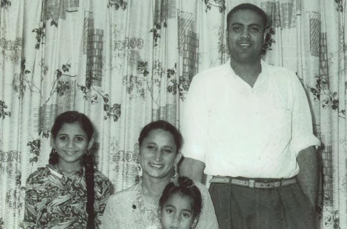 [Photo of Bachan Kaur Alamwala with her husband and two oldest children]a