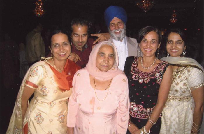 [Photo of the Sidhu family at a reception]