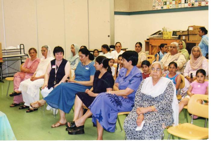 [Photo of Surjit Kaur in a classroom]