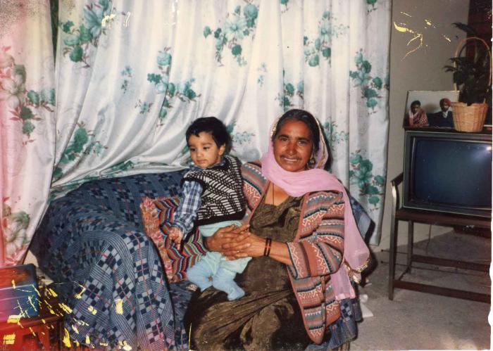 [Photo of Surjit Kaur with her grandson]