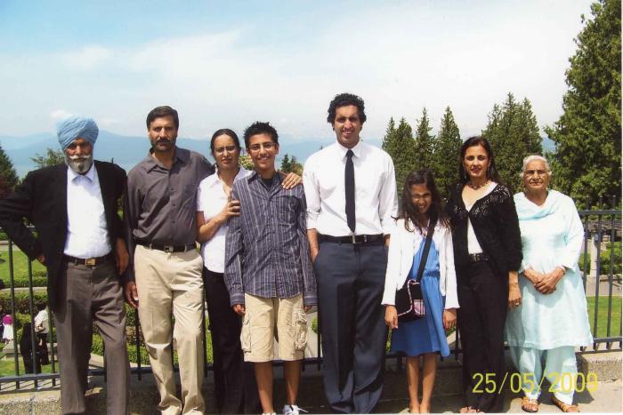 [Photo of Surjit Kaur with her daughter's family and husband]