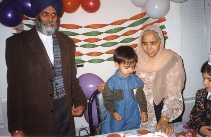 [Photo of Surjit Kaur celebrating her grandson's birthday]