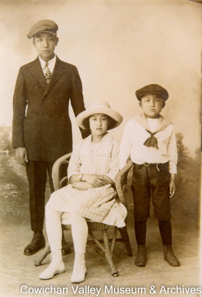 [Sam Asada, Masaye Yamada, and Cossy Asada posing for a family photo]
