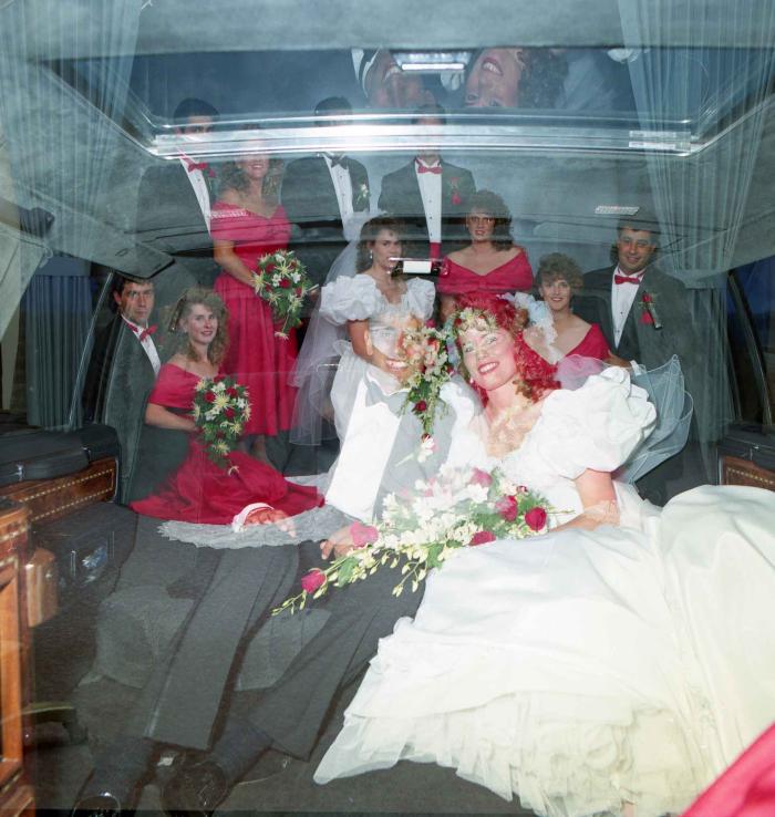 [Merged photograph of Mal Gill and Leanne Neitch with their groomsmen and bridesmaids]