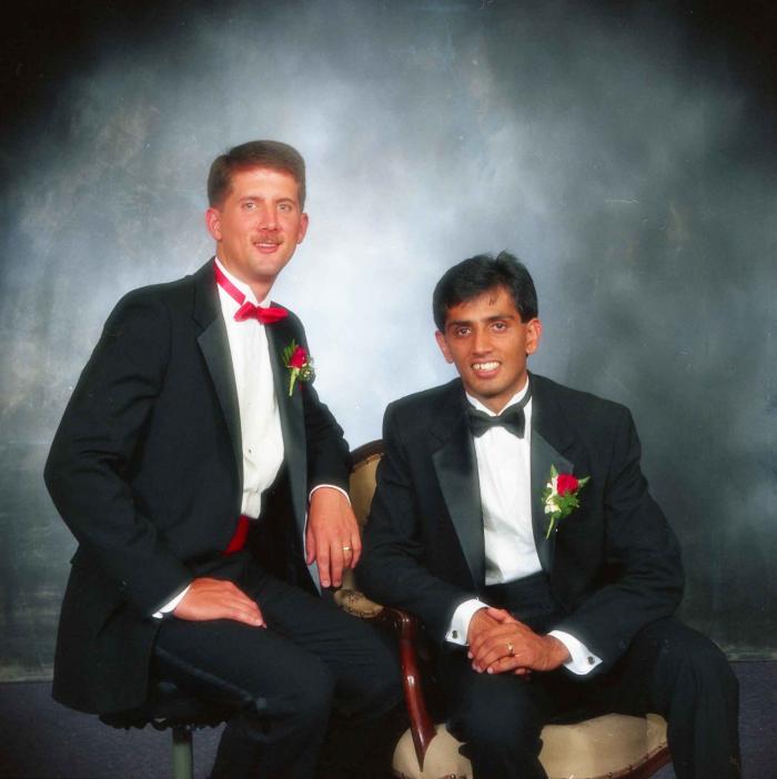 [Photo of Mal Gill and a groomsmen]
