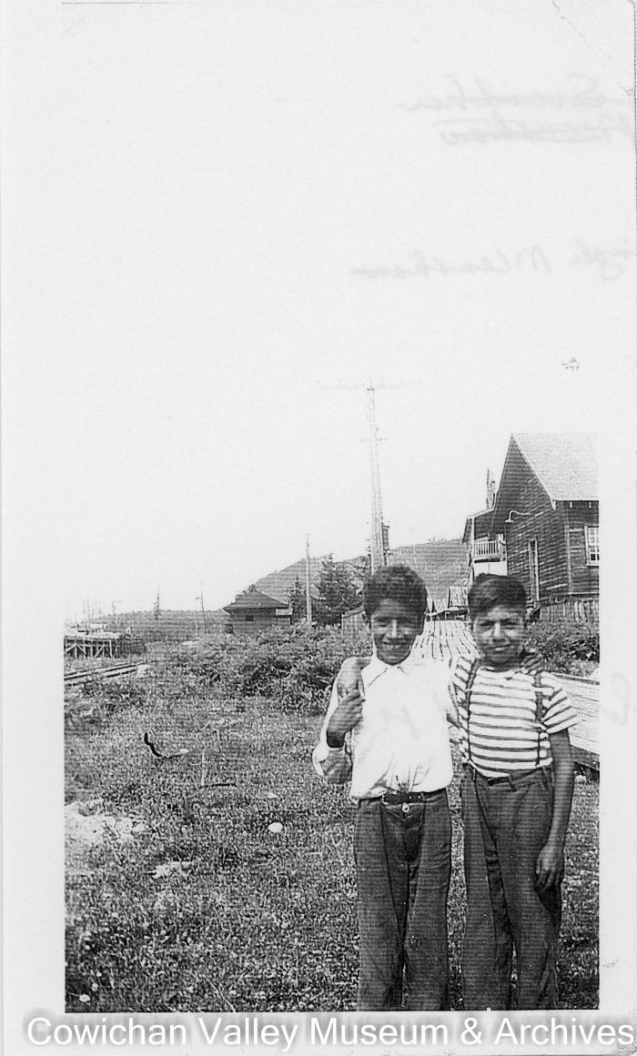 [Two young boys posing for a photo]