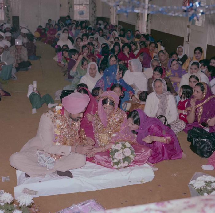 [Photo of Gurmeet Sidhu and Tina Gill]
