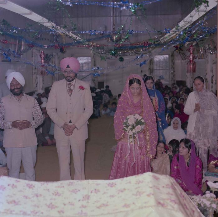 [Photo of Gurmeet Sidhu and Tina Gill]