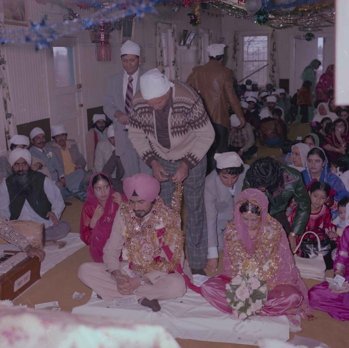 [Photo of Gurmeet Sidhu and Tina Gill]