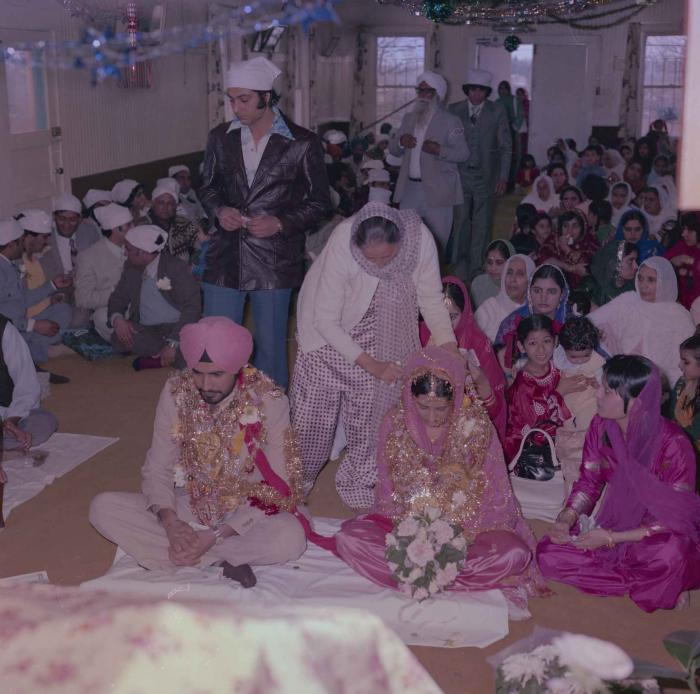 [Photo of Gurmeet Sidhu and Tina Gill]