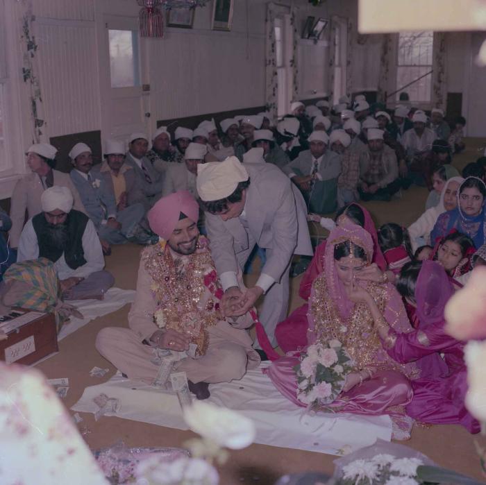 [Photo of Gurmeet Sidhu and Tina Gill]