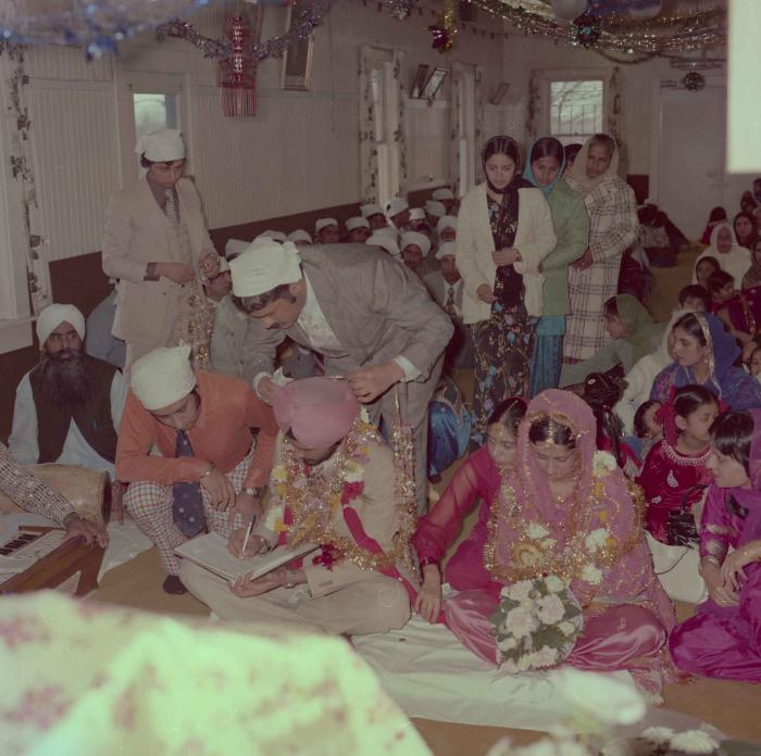 [Photo of Gurmeet Sidhu and Tina Gill]