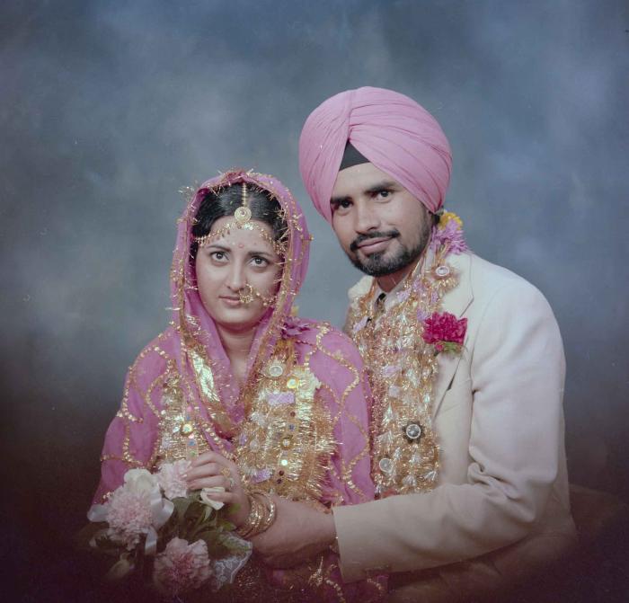 [Photo of Gurmeet Sidhu and Tina Gill]