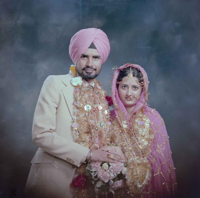 [Photo of Gurmeet Sidhu and Tina Gill]