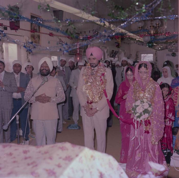 [Photo of Gurmeet Sidhu and Tina Gill]