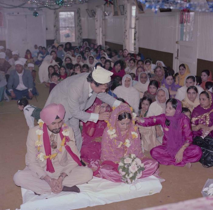 [Photo of Gurmeet Sidhu and Tina Gill]