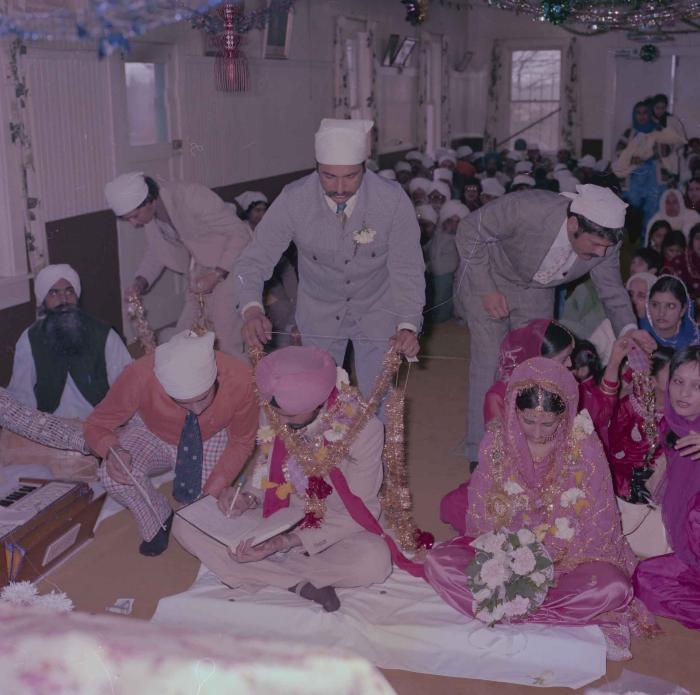 [Photo of Gurmeet Sidhu and Tina Gill]
