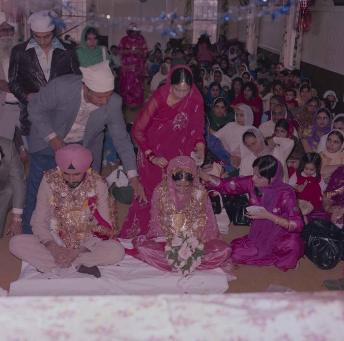 [Photo of Gurmeet Sidhu and Tina Gill]