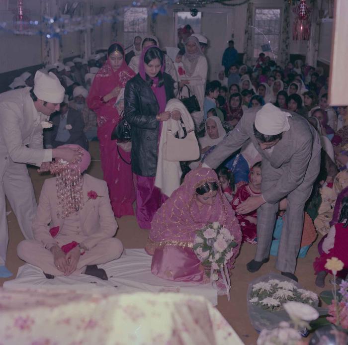 [Photo of Gurmeet Sidhu and Tina Gill]