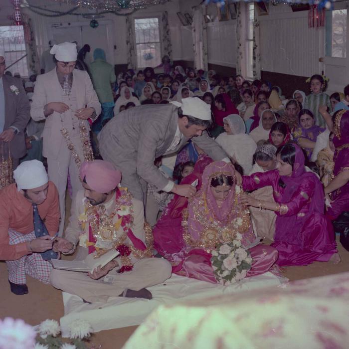 [Photo of Gurmeet Sidhu and Tina Gill]