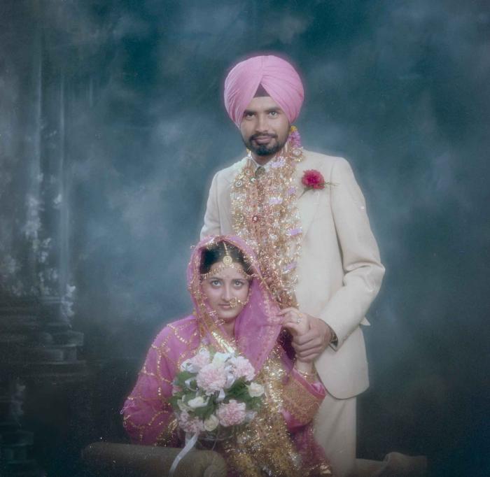 [Photo of Gurmeet Sidhu and Tina Gill]