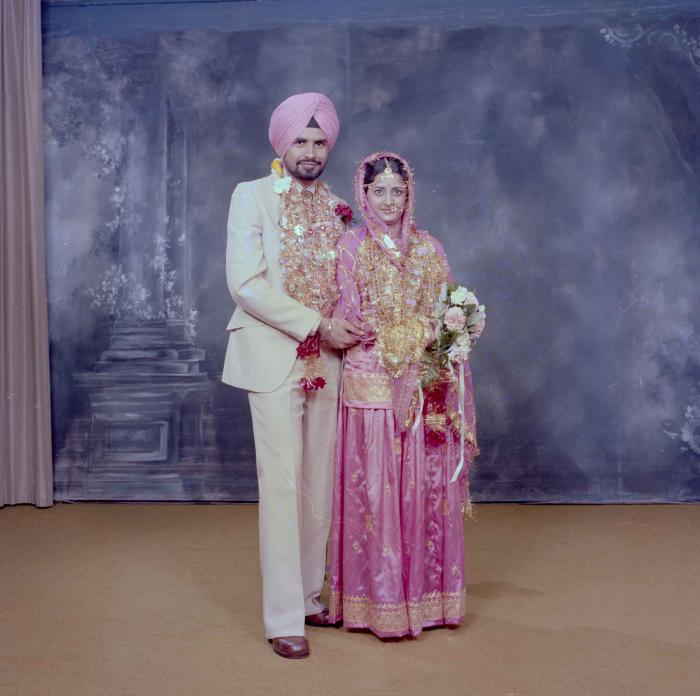 [Photo of Gurmeet Sidhu and Tina Gill]