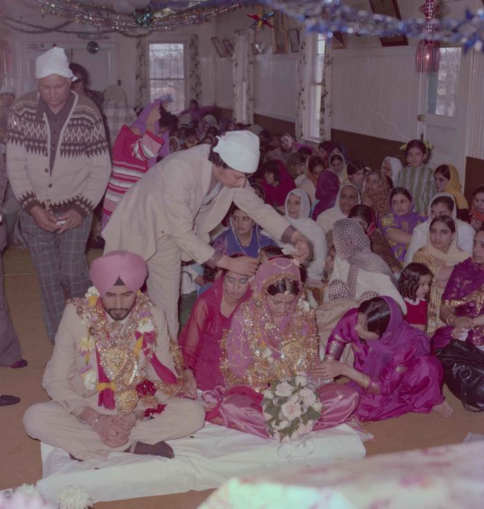 [Photo of Gurmeet Sidhu and Tina Gill]