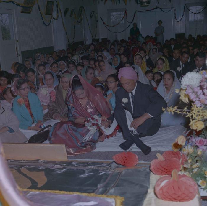[Photo of Gurdev Singh and Sarjit Kaur]