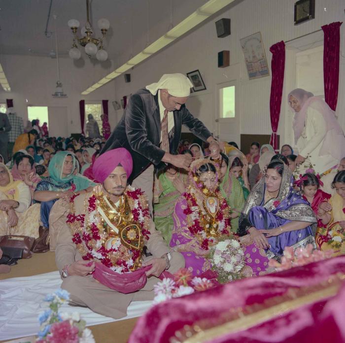 [Photo of Baljit Sidhu and Inderjit Gill]