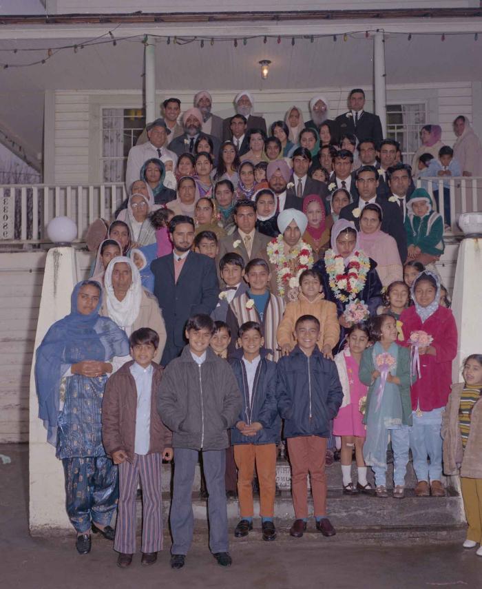 [Photo of Gurmel Singh with an unidentified bride and wedding guests]
