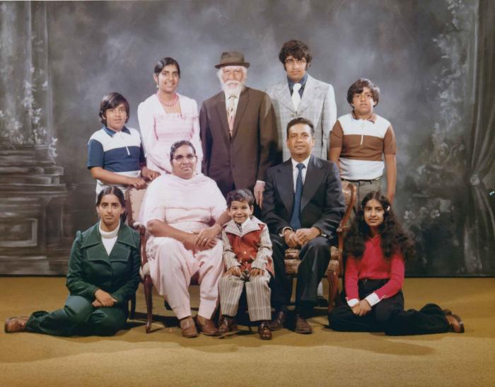 [Photo of Mukhtiar Singh with family members]