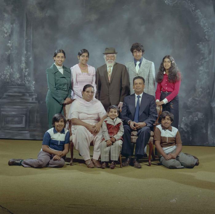 [Photo of Mukhtiar Singh with family members]