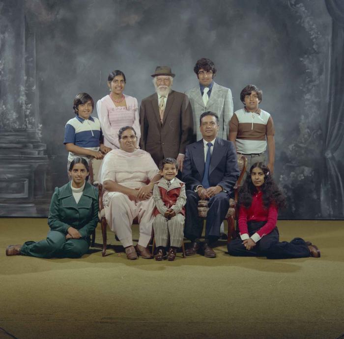 [Photo of Mukhtiar Singh with family members]