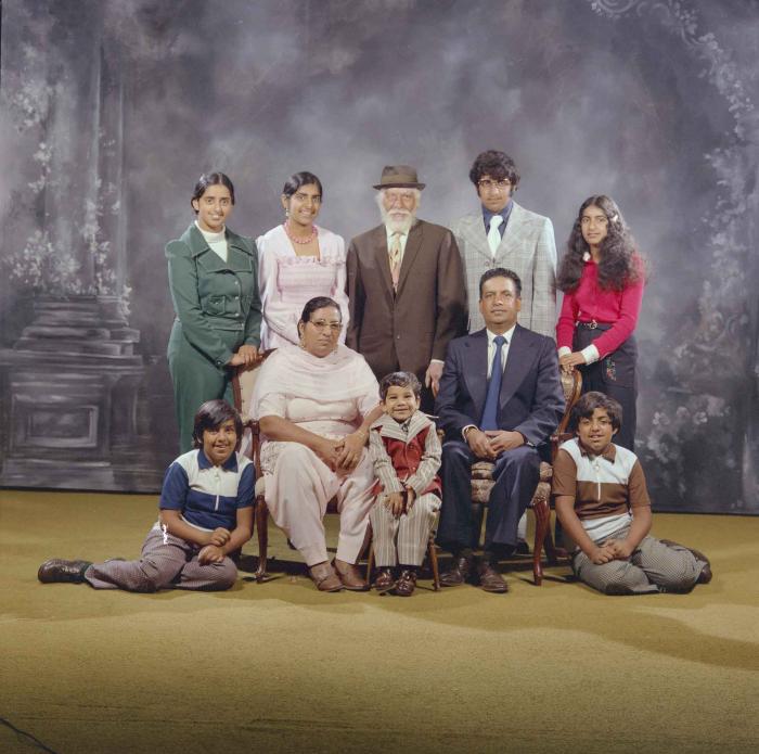 [Photo of Mukhtiar Singh with family members]